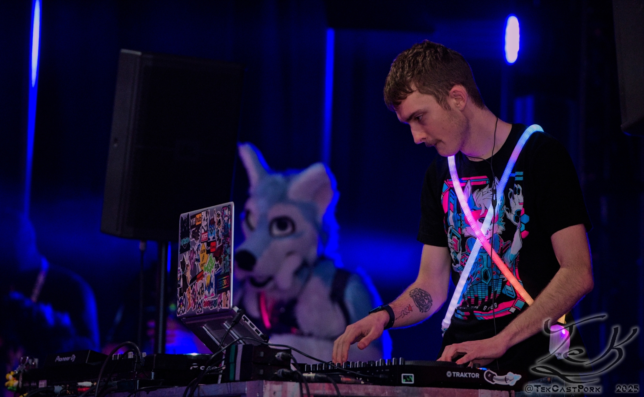 Photo of Zee the Raccoon holding a camcorder, photo taken by Dozing Unicorn